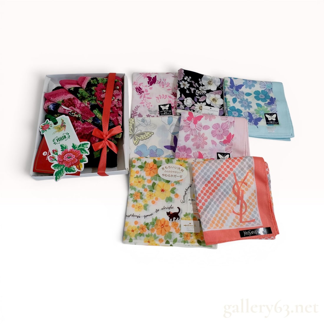 A Collection of Designer Pocket Squares and a Feiler Chenille Pouch: This group of accessories includes cotton designer pocket squares and a zippered pouch from makers Yves Saint Laurent, Pierre Balmain, Feiler, Hanae Mori, and more. The collection features a black cot