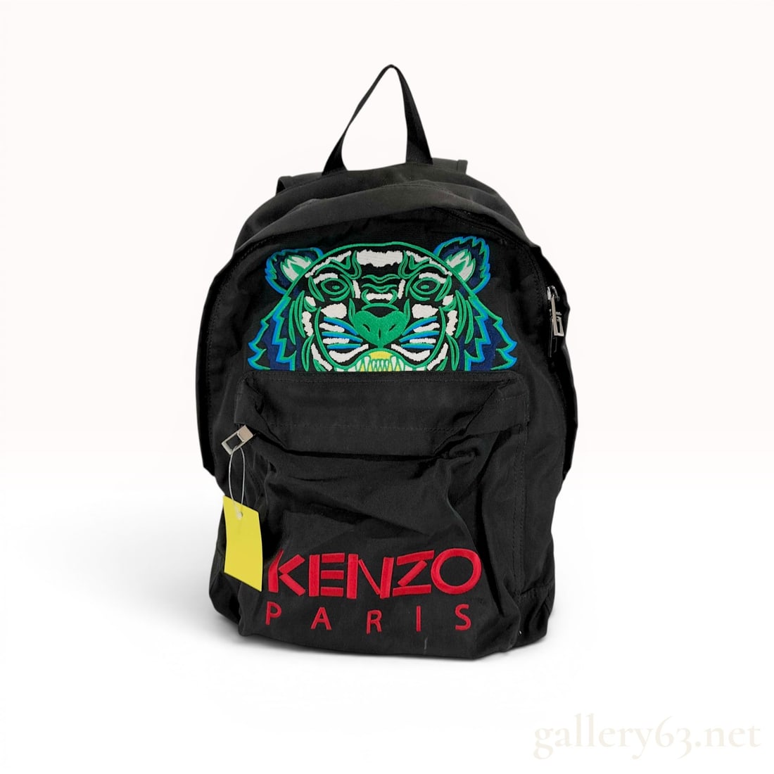 Kenzo Paris Tiger Canvas Backpack: Kenzo Paris Tiger canvas backpack, contemporary. Black textile construction features a multi-colored embroidered tiger head motif and red logo embroidery on the front zippered pouch. Includes adjustab