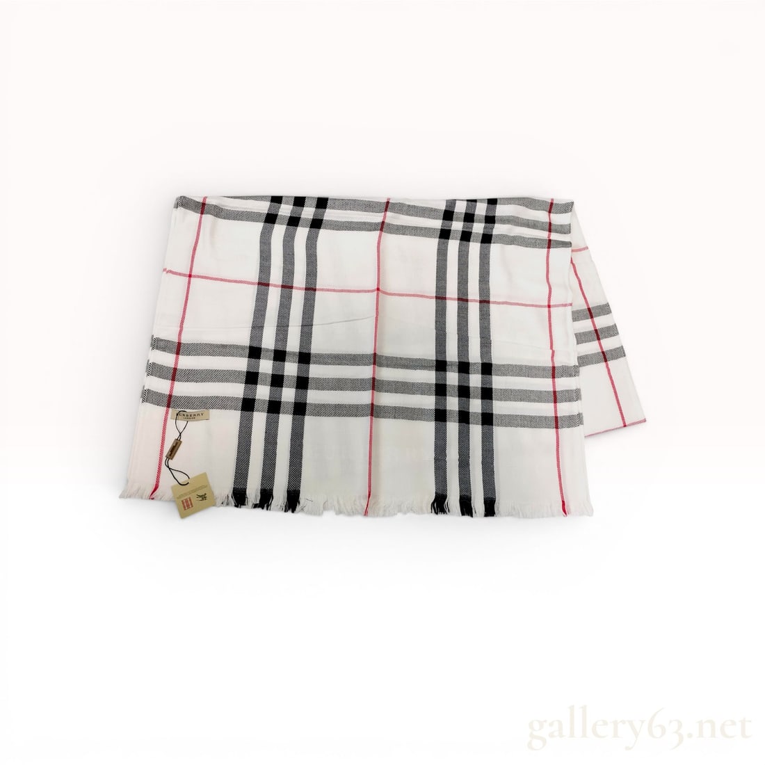Burberry London Signature Check and Tonal Jacquard Scarf: A Burberry London scarf featuring the signature house check in a colorway of white, black, and red. The lightweight, semi-translucent fabric is enhanced with a tonal jacquard weave throughout the body