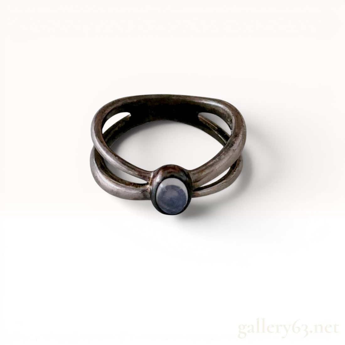 Sterling Silver and 14K Gold Split-Shank Fashion Ring with Moonstone Cabochon: Contemporary unbranded fashion ring featuring a sculptural split-shank double-band design crafted from sterling silver with 14-karat gold accents. A central bezel-set oval translucent moonstone caboch