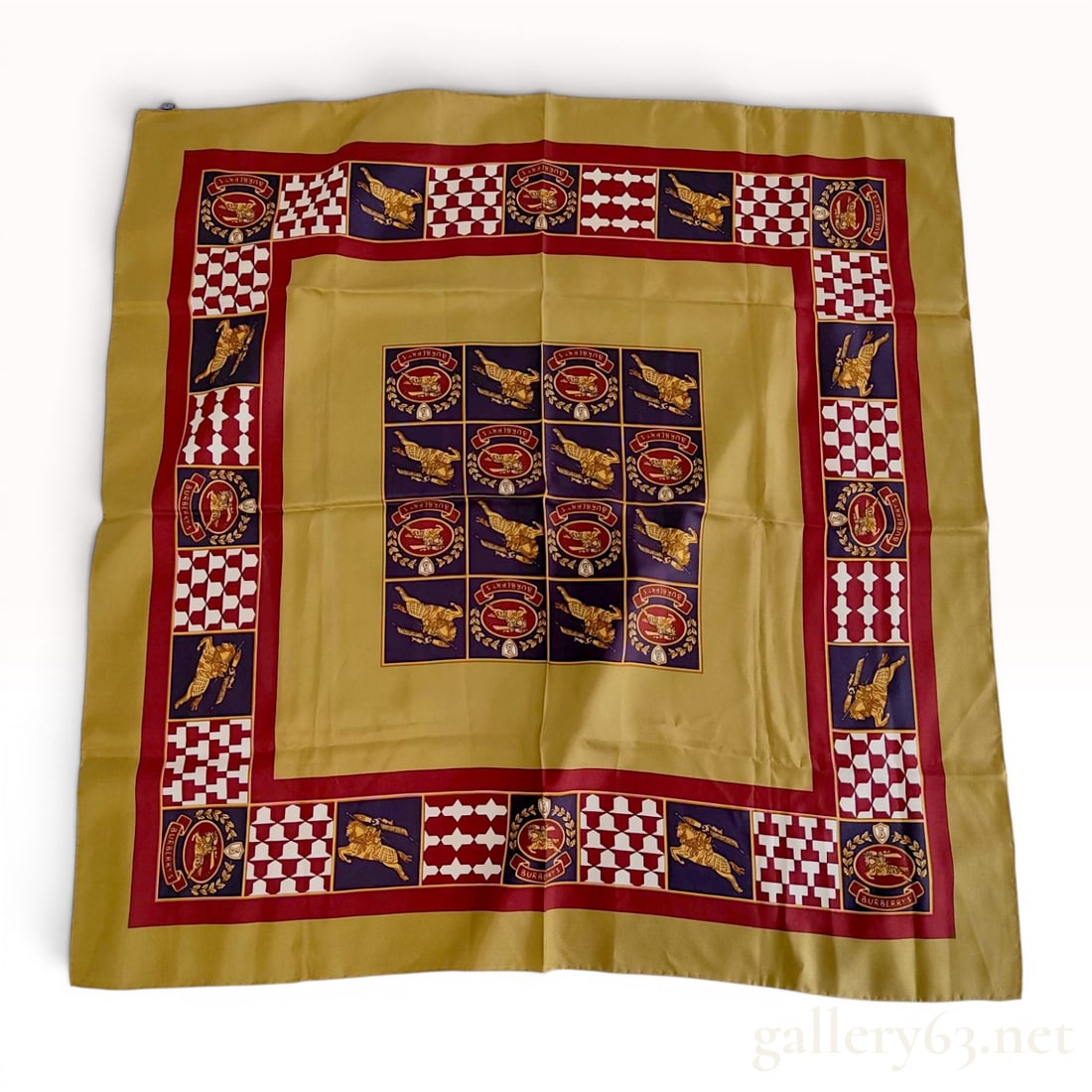 Vintage Burberrys Silk Scarf with Equestrian Knight and Geometric Pattern: Vintage Burberrys square silk scarf featuring a heraldic-inspired multi-panel design, circa 1990s. The pattern includes the signature equestrian knight emblem and "PRORSUM" banners set withi