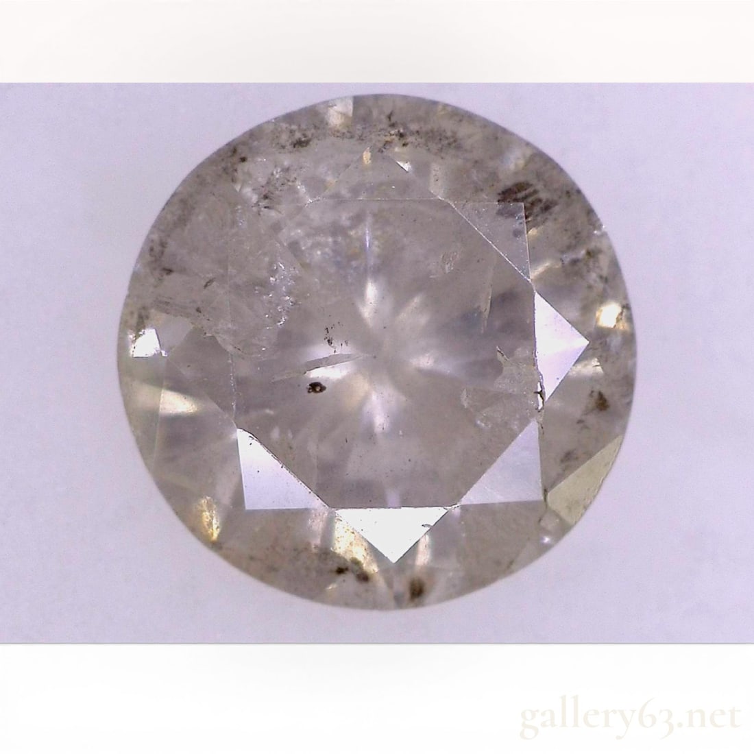 0.945 Carat Round Brilliant Cut Natural Diamond: This loose natural diamond is a round brilliant cut, accompanied by a grading report from the Japan Gem Science Association (No. 20W-3162). Per the documentation, the stone is graded with a color of K