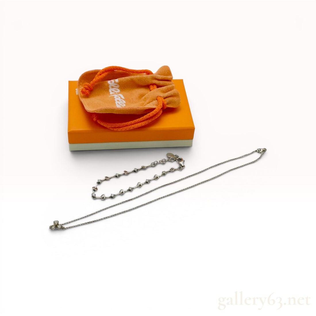 A Folli Follie Sterling Silver Necklace and Bracelet Jewelry Set w/Box: Folli Follie sterling silver jewelry set including a pendant necklace and matching link bracelet, presented with a branded orange box and velvet pouch. The necklace features a cable chain with a three