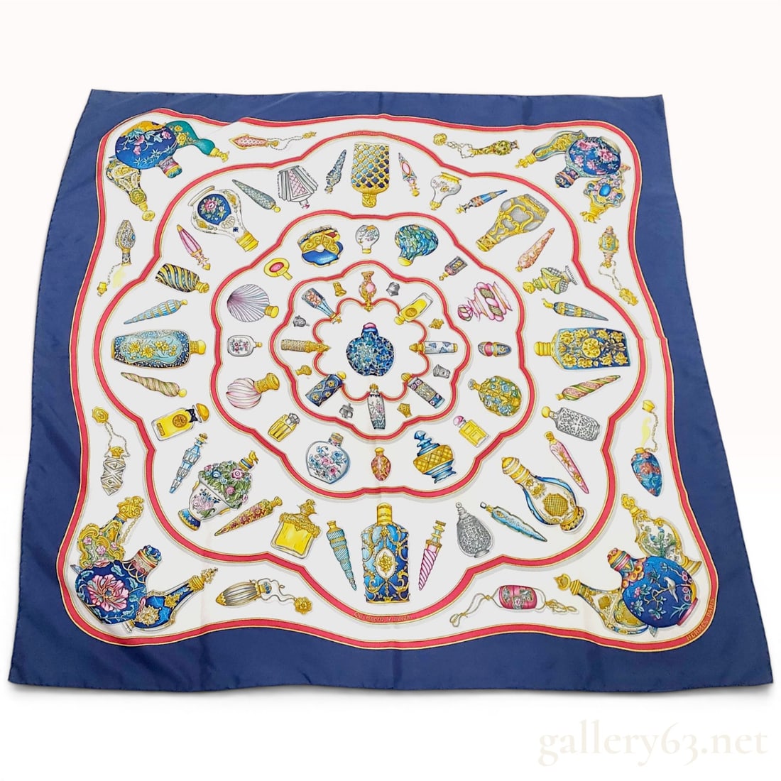 Hermes Qu'importe le flacon Silk Scarf by Catherine Baschet: Hermès Paris silk twill scarf in the Qu'importe le flacon (What matters the bottle) pattern, originally designed by Catherine Baschet and first issued in 1988. The design features a concentric 
