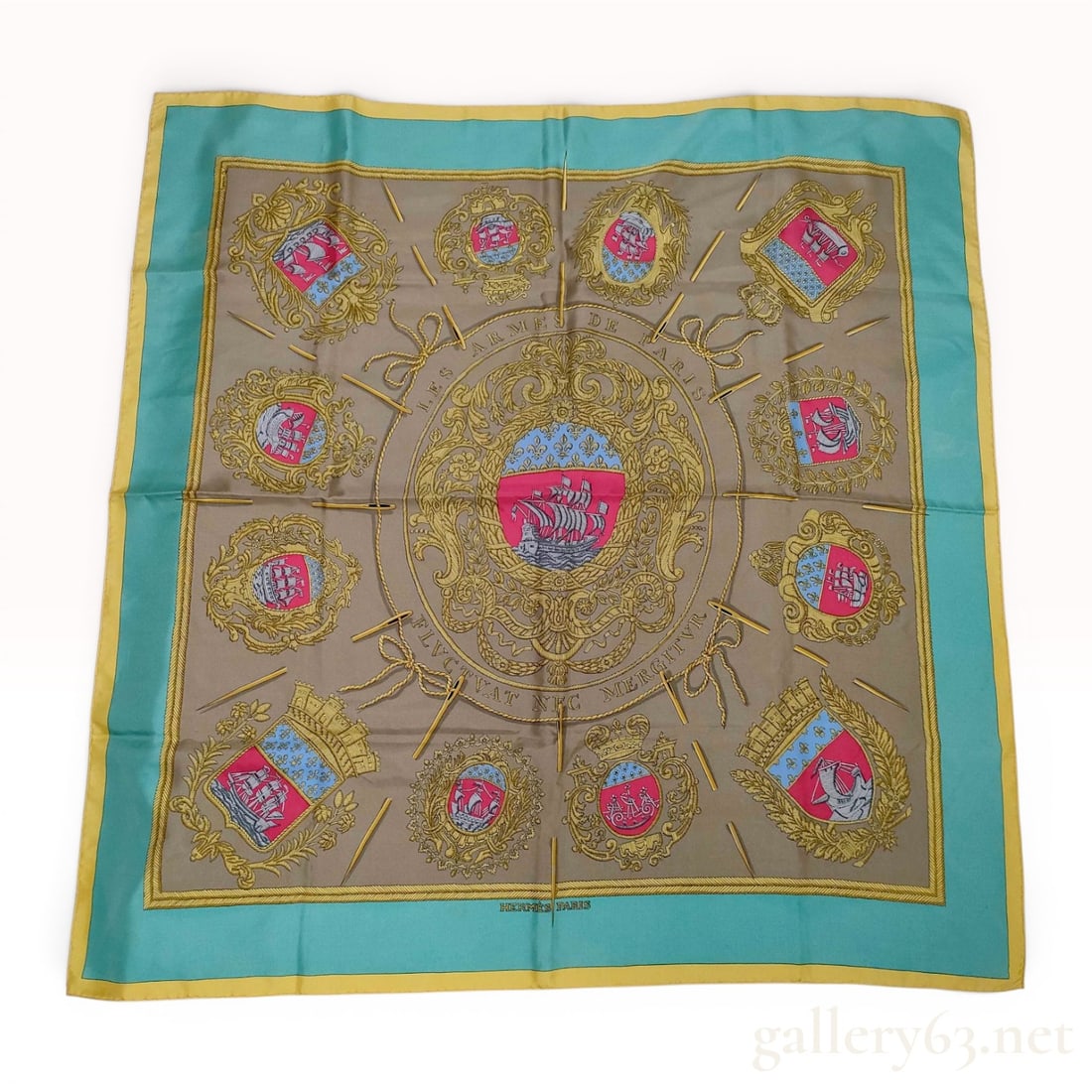 Hermes Les Armes de Paris Silk Scarf: Hermès silk twill scarf in the Les Armes de Paris pattern, a design originally issued in 1954 and attributed to Hugo Grygkar. The composition features the central coat of arms of Paris surround