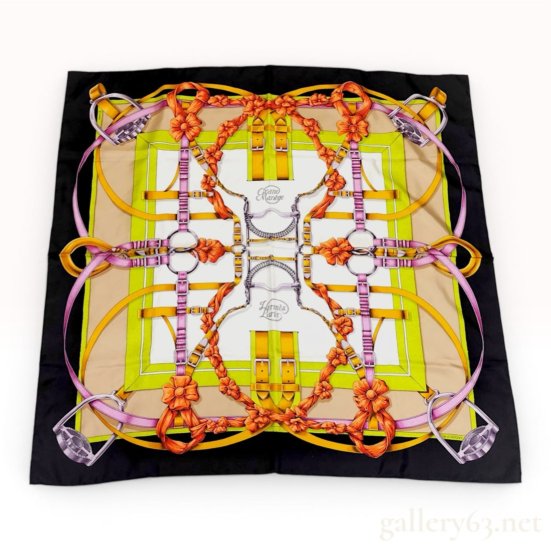 Hermes Grand Manege 90cm Silk Scarf designed by Henri d'Origny: This Hermès Carré 90 silk scarf features the Grand Manège equestrian-themed pattern designed by Henri d'Origny. The design includes elaborate horse bits, stirrups, buckles, and le