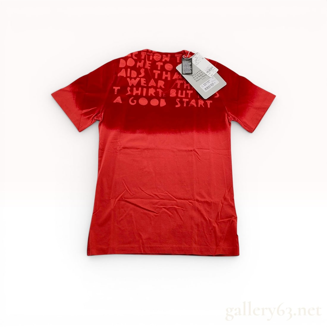 Maison Margiela MM6 Red Cotton V-Neck T-Shirt: Maison Margiela MM6 short-sleeved V-neck T-shirt crafted from 100 percent red cotton jersey and features tonal red flocked lettering. The shirt retains its original paper retail tags, including the Ma