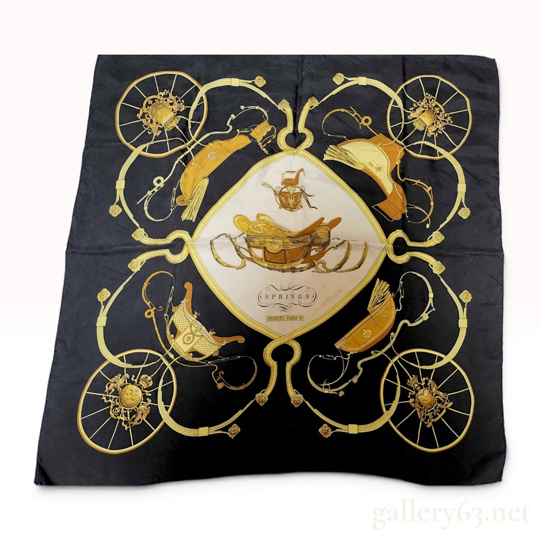 Hermes Springs Silk Scarf w/Box: Hermes silk twill scarf in the Springs pattern designed by Philippe Ledoux, mid-to-late 20th century. The equestrian-themed motif depicts carriages, wheels, and harnesses in shades of gold, yellow, an