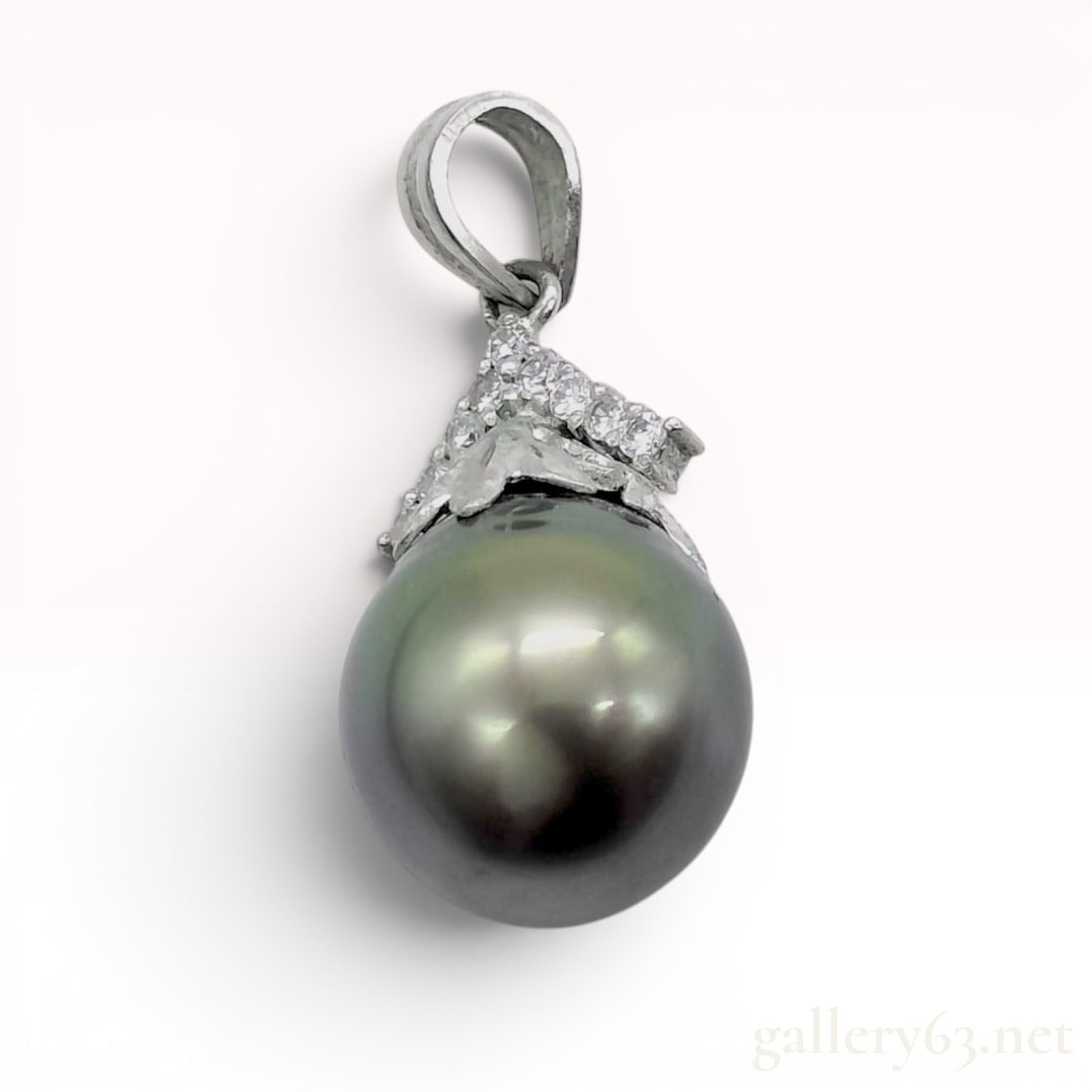 Tahitian Cultured Pearl and Diamond Platinum Pendant: Tahitian cultured pearl and diamond pendant set in 900-grade platinum. The pendant features a near-round charcoal-grey pearl with peacock-green and rose overtones, suspended from a foliate-style cap p