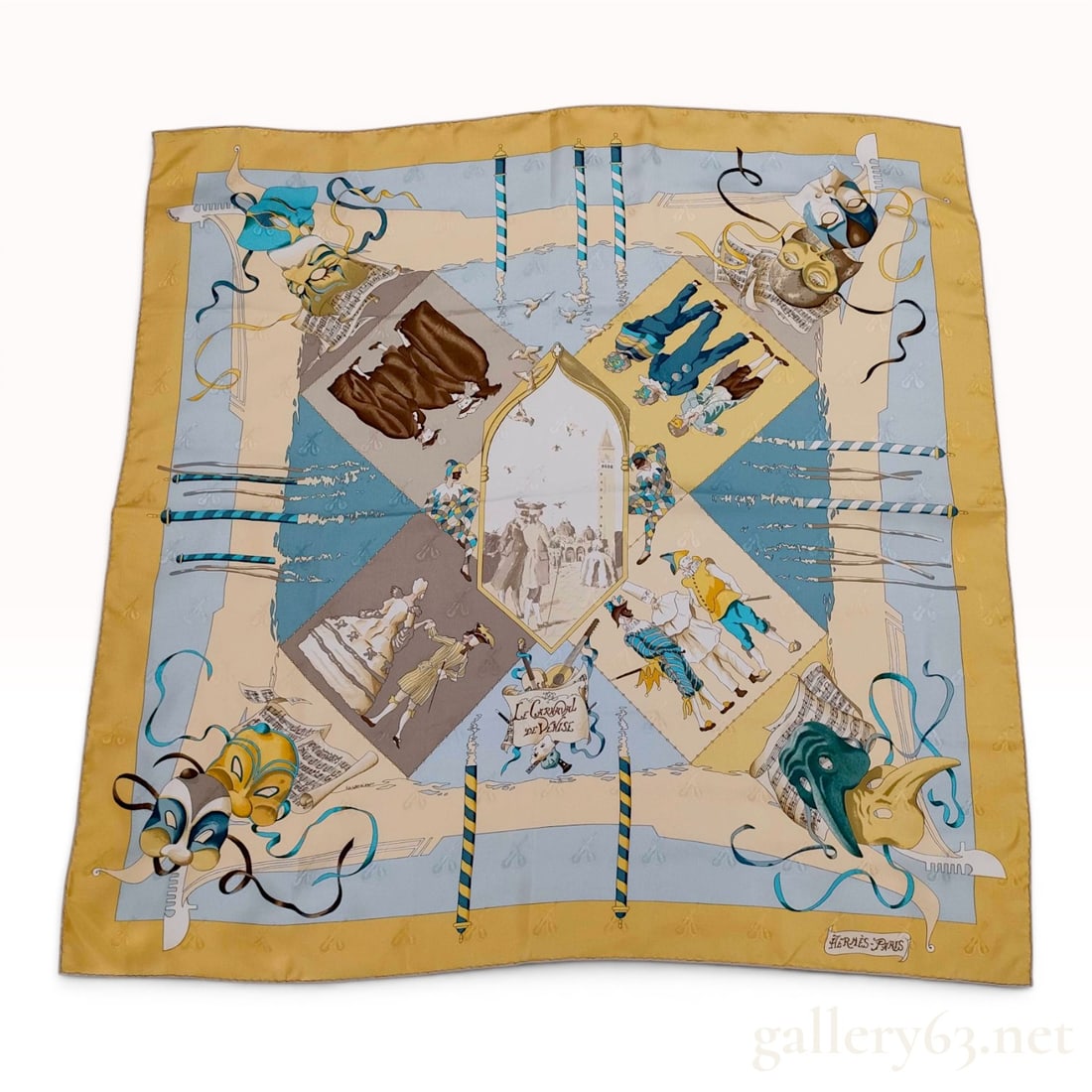 Hermes Le Carnaval de Venise Jacquard Silk Scarf: Hermès silk scarf in the Le Carnaval de Venise pattern, designed by artist Hubert de Watrigant. The yellow and light blue design is printed on jacquard silk featuring a tonal weave of musical i