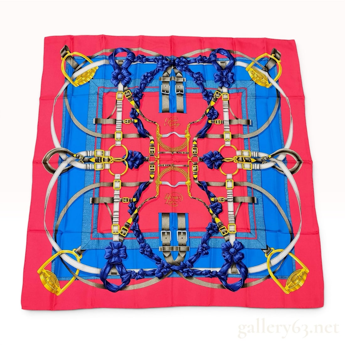 Hermes Silk Twill Carre 90 Scarf Grand Manege Pattern by Henri d'Origny: Hermès silk twill Carre 90 scarf in the Grand Manege pattern, designed by Henri d'Origny. The equestrian design features a symmetrical arrangement of bits, stirrups, and leather straps accented