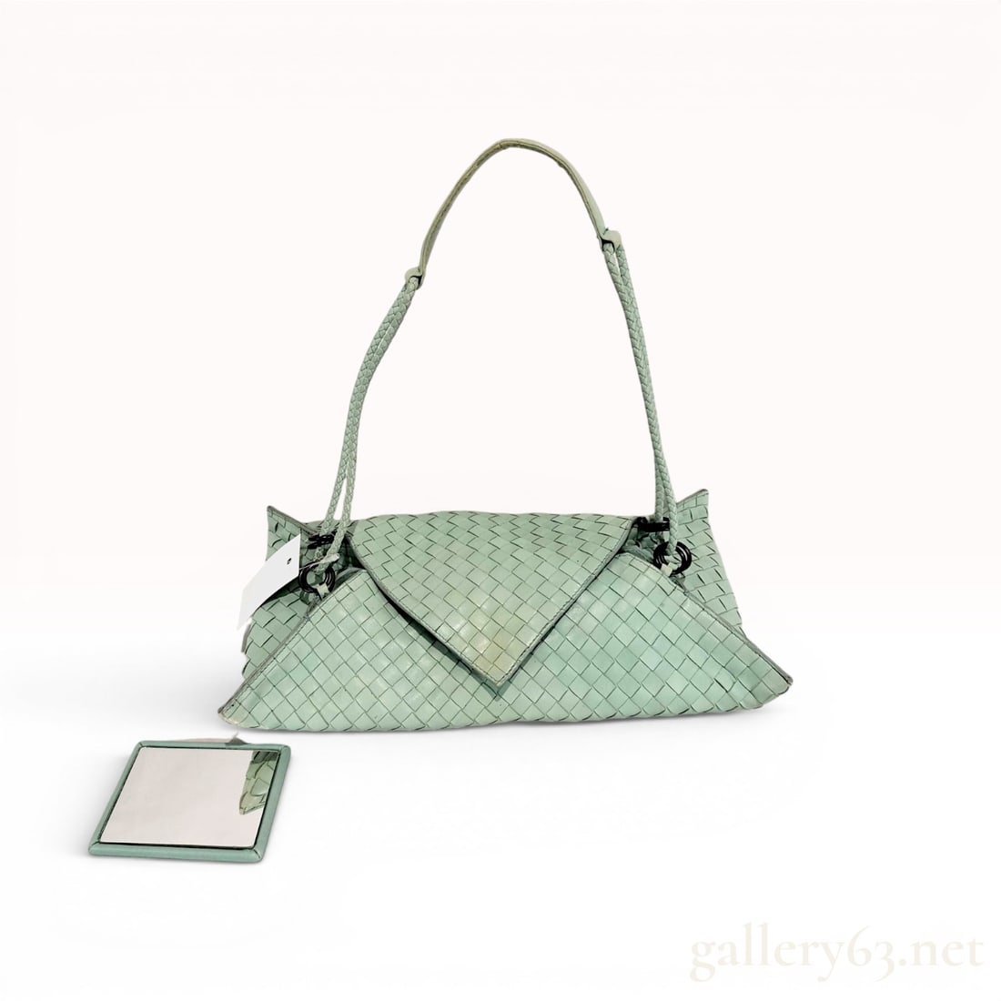 Bottega Veneta Mint Green Intrecciato Woven Leather Triangle Flap Shoulder Bag: Bottega Veneta shoulder bag featuring the brand's signature intrecciato hand-woven leather construction. Crafted from mint green nappa leather, the bag displays a unique structural design with a large