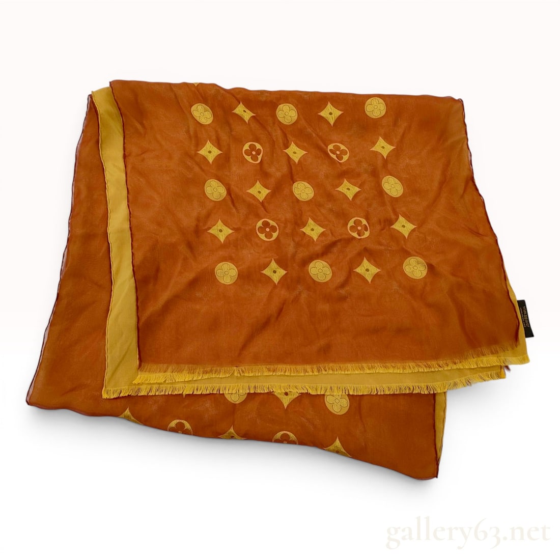 Louis Vuitton Etole Venise Monogram Silk Stole in Orange and Yellow: Louis Vuitton Etole Venise monogram stole, contemporary. This reversible jacquard-weave piece features the signature Monogram pattern in a two-tone burnt orange and golden yellow colorway with fine fr