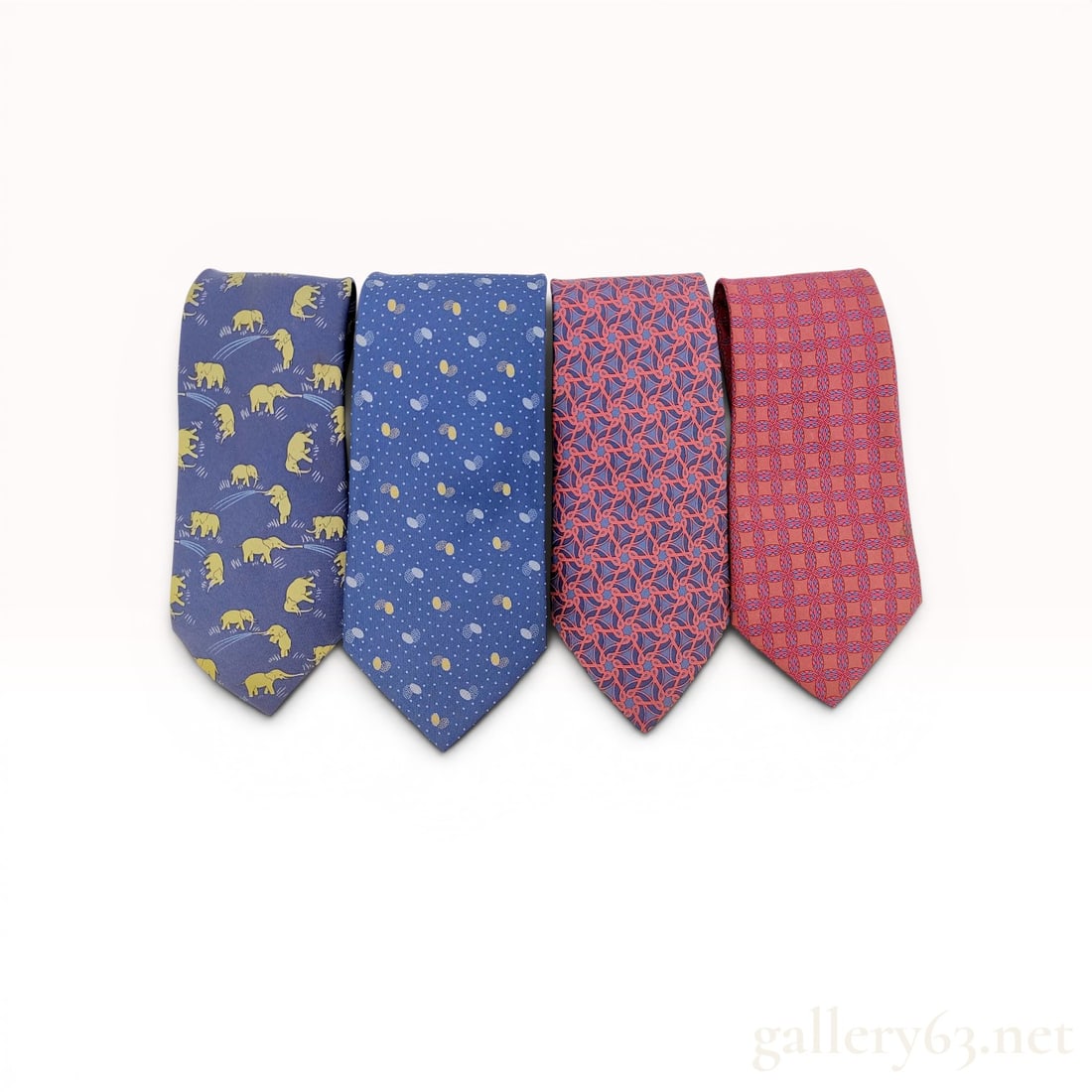 A Collection of Hermes Silk Ties - Elephants, Teardrops, Scrolls and more: A collection of Herm?¨s silk neckties featuring various graphic patterns and motifs including animal and geometric designs. Patterns include a navy blue elephant print (reference 7111 OA), a blue abs