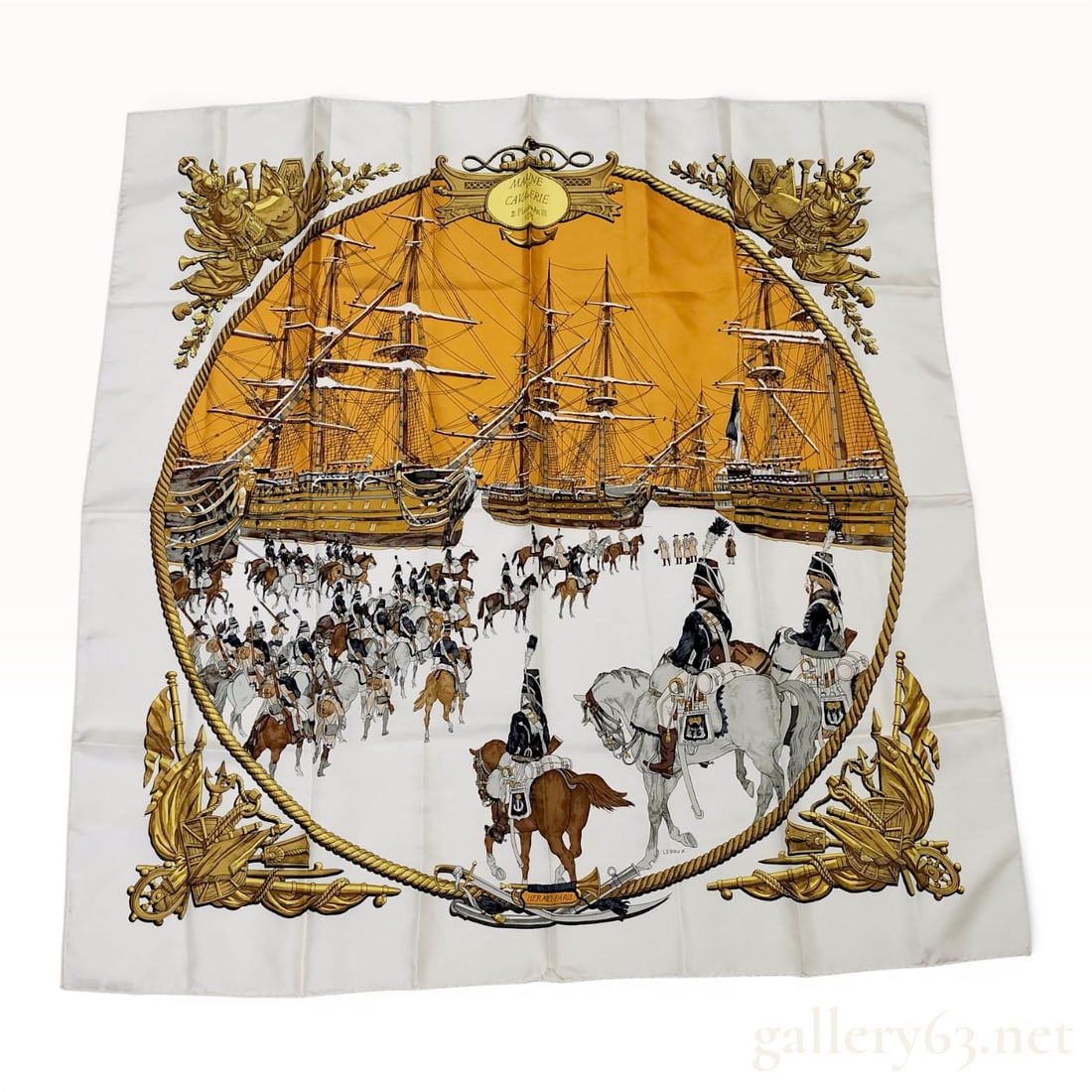 Hermes Marine et Cavalerie Silk Scarf: Hermès silk twill scarf in the Marine et Cavalerie pattern, designed by Philippe Ledoux and first issued in 1966. Hand-rolled silk featuring a central oval scene of cavalry and ships on an oran