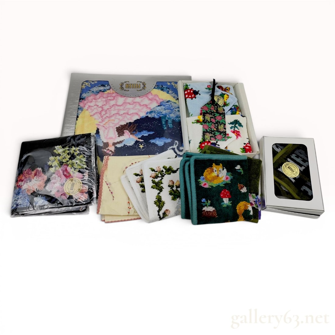 A Collection of Feiler German Chenille Hand Towels and Pocket Squares: An assortment of German chenille textiles by Feiler, including the 2023 Annual Edition picture towel and a boxed Heidi pattern set. The collection features various hand towels and pocket squares with 