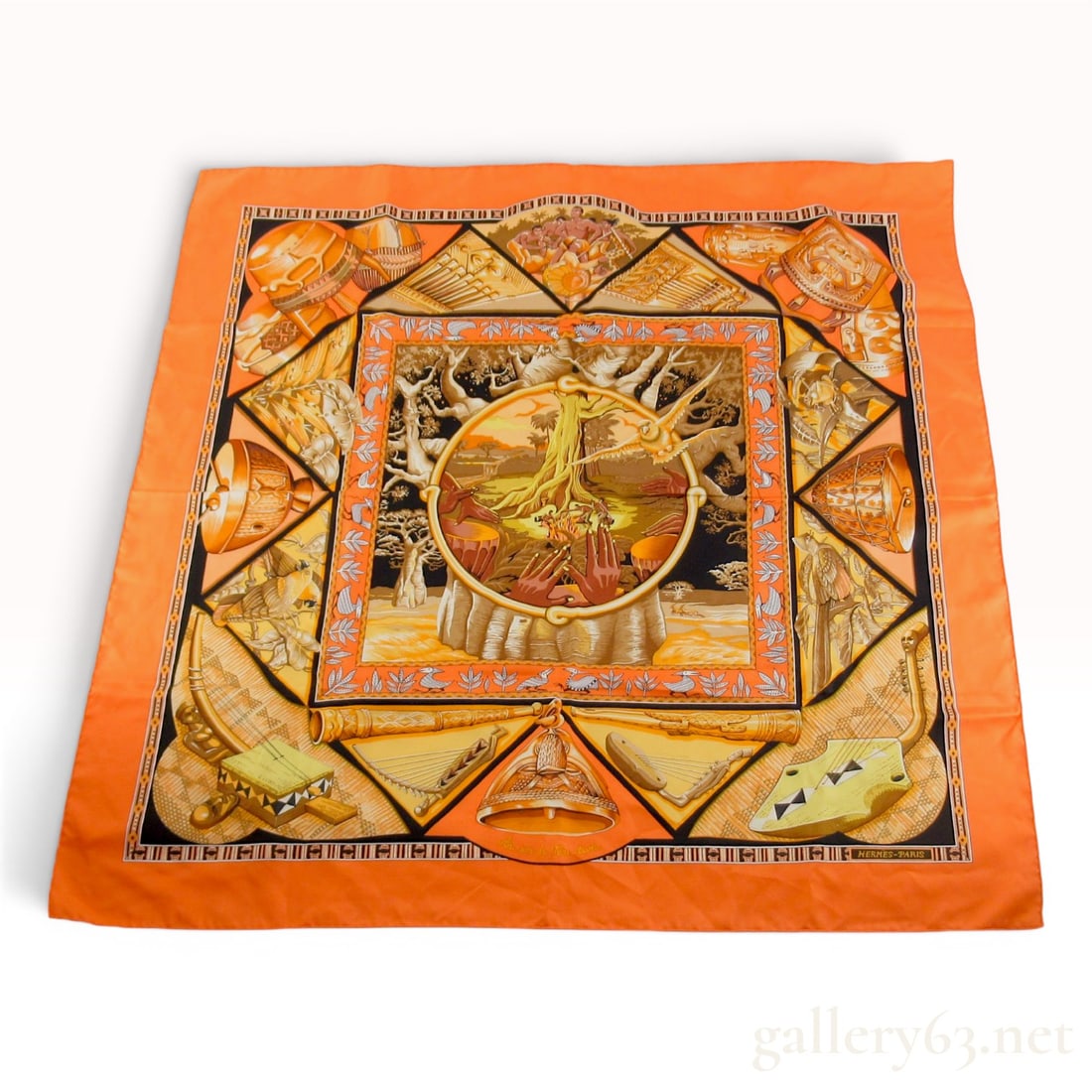 Hermes Au Son du Tam-tam Silk Carre 90 Scarf: Hermès silk twill scarf in the Au Son du Tam-tam pattern designed by Laurence Bourthoumieux. The design features a complex arrangement of African musical instruments, local wildlife, and a cent