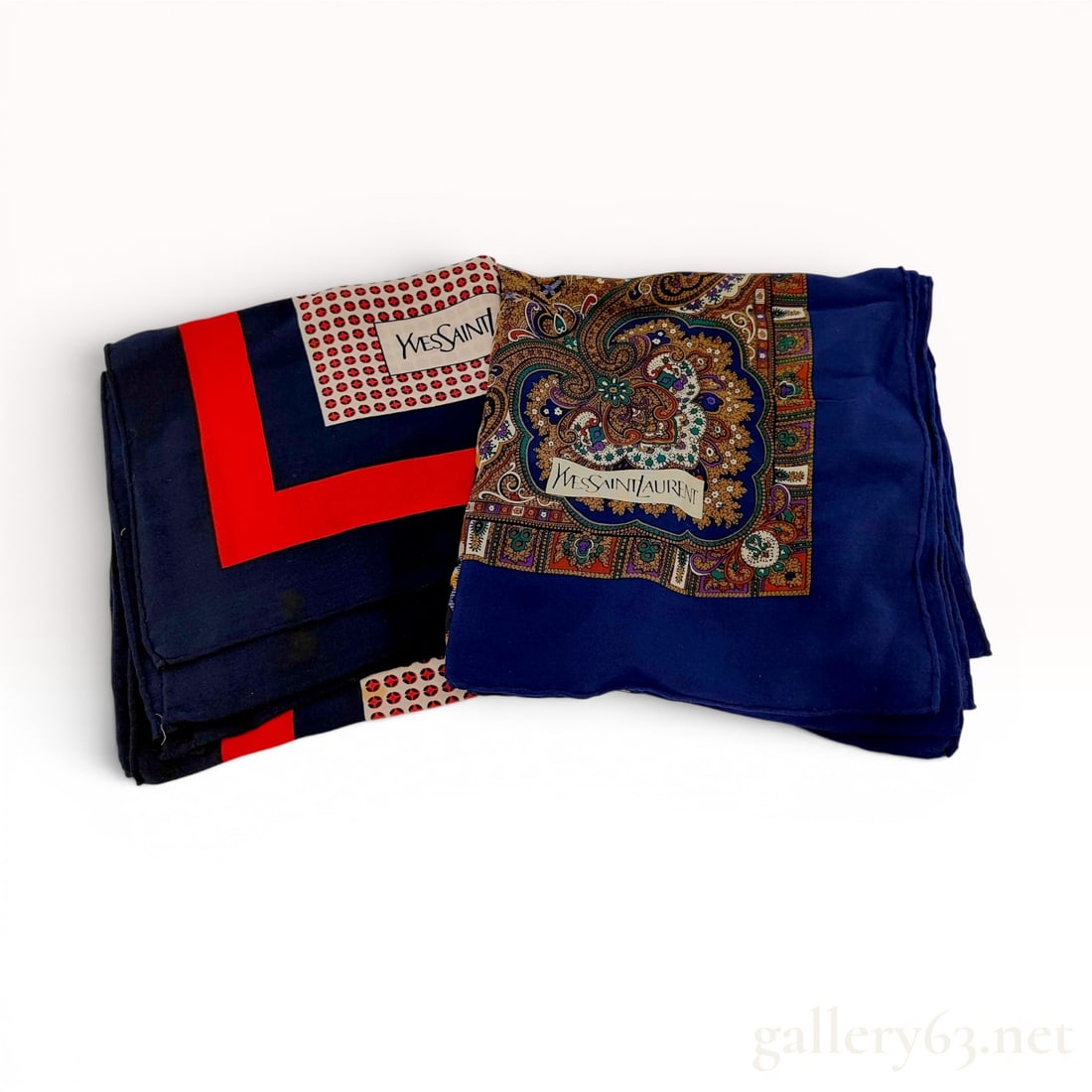 Set of Two Yves Saint Laurent Silk Square Scarves: Yves Saint Laurent set of two silk square scarves, late 20th century. One scarf features a navy and red bordered geometric dotted pattern, while the second displays a multicolor paisley border and dia