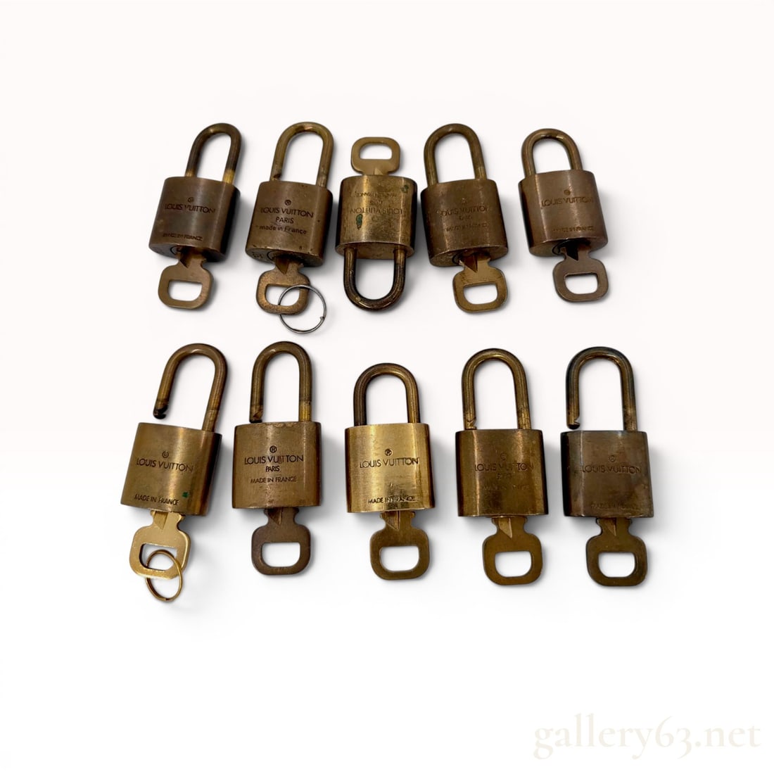 Set of 10 Louis Vuitton Brass Padlocks and Matching Keys: Set of 10 Louis Vuitton brass padlocks and matching keys, contemporary luxury luggage accessories manufactured in France. Each padlock is cast in solid brass featuring the brand's trademark logo on th