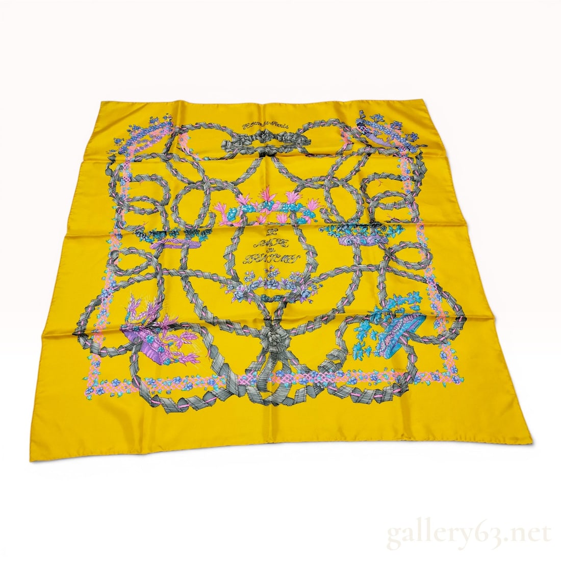 Hermes Le Sacre du Printemps Silk Scarf with Original Box: Hermès Paris silk scarf in the Le Sacre du Printemps pattern, designed by Henri d'Origny. The 100% silk twill piece features a yellow ground decorated with grey ribbon motifs forming knots and 