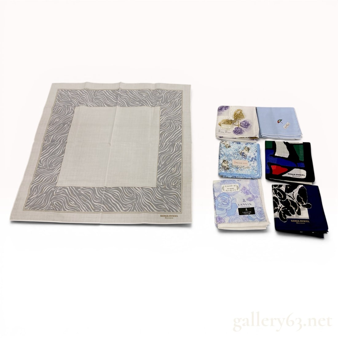 A Set of 7 Designer Pocket Squares including Arnold Palmer & Lanvin: An assortment of 7 designer pocket squares featuring items from Sonia Rykiel, Nina Ricci, Lanvin, Paul & Joe Sister, and Arnold Palmer. Crafted from 100% cotton, the pieces showcase varied designs ran