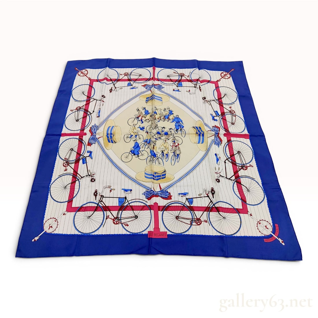 Hermes Silk Carre 90 Scarf in Les Becanes Pattern: Hermès 100% silk carré in the Les Becanes pattern, originally designed by artist Hugo Grygkar in 1954. The screen-printed design features antique bicycles, tandems, and velocipedes set w