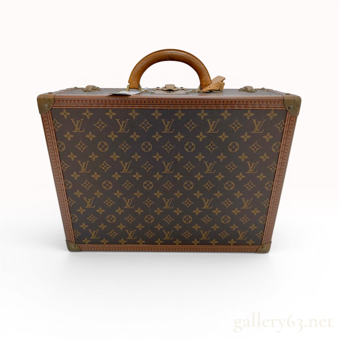 Vintage Louis Vuitton Monogram Bisten 45 Hard-Sided Suitcase: This vintage hard-sided suitcase by Louis Vuitton is a Bisten 45 model, featuring the house's signature Monogram coated canvas. The structure is reinforced with brown lozine trim secured by brass rive