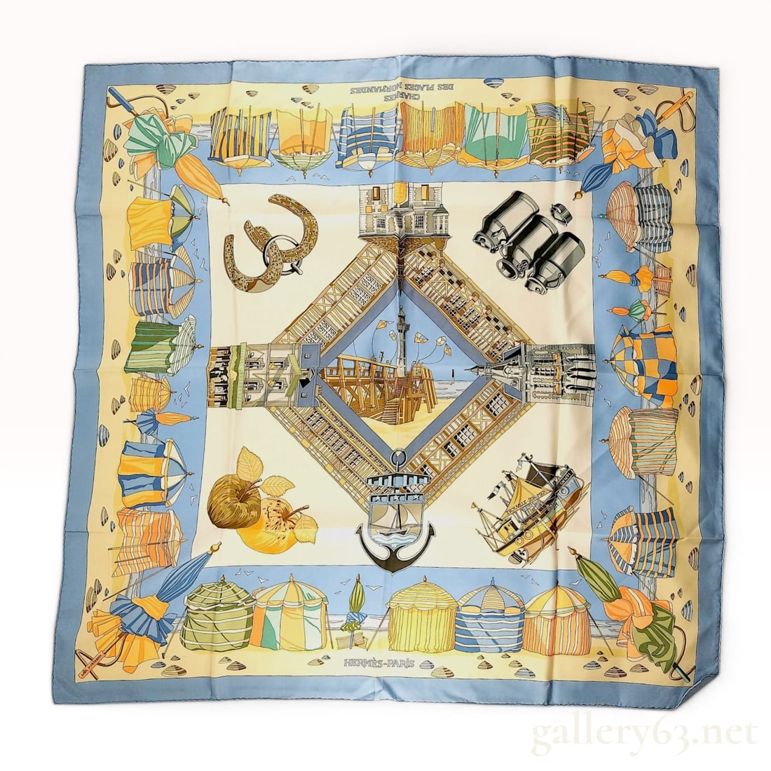 Hermes Charmes des Plages Normandes Silk Scarf by Loic Dubigeon: This Hermès 90cm silk twill scarf features the Charmes des Plages Normandes motif designed by artist Loïc Dubigeon. The design illustrates elements of the Normandy coast, centered by a dia