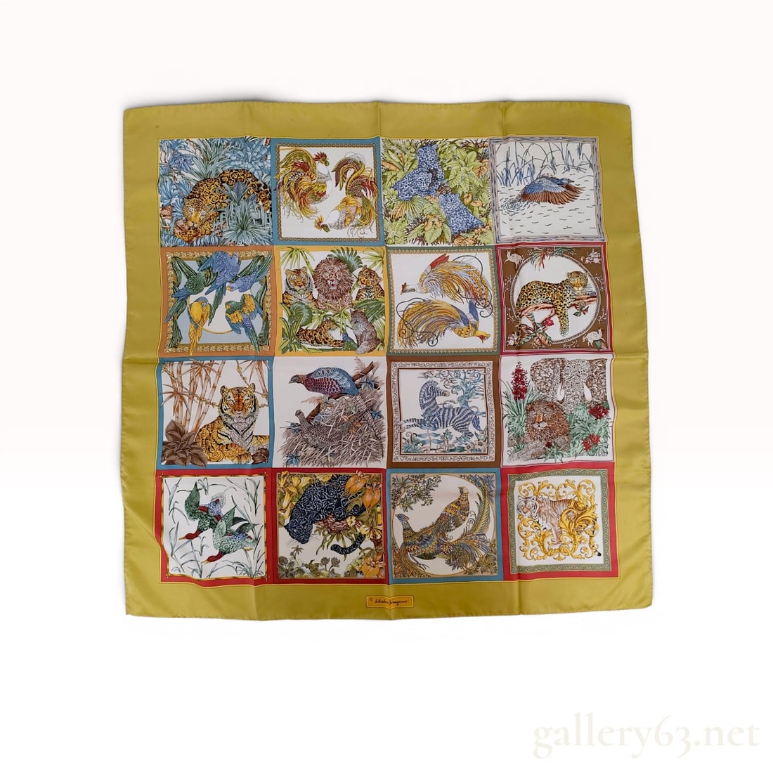 Salvatore Ferragamo Multi-Panel Wildlife Silk Scarf: Salvatore Ferragamo silk twill scarf featuring a 16-panel grid of naturalistic animal and bird illustrations, late 20th century. The multi-colored motifs include tigers, leopards, zebras, and exotic b