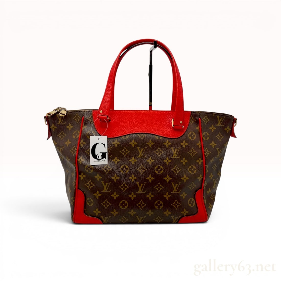Louis Vuitton Monogram Estrela NM Shoulder Bag with Red Trim: Louis Vuitton Estrela NM shoulder bag in signature Monogram coated canvas with Coquelicot red grained leather trim. This model features double rolled leather handles, a double-zip top closure, and gol