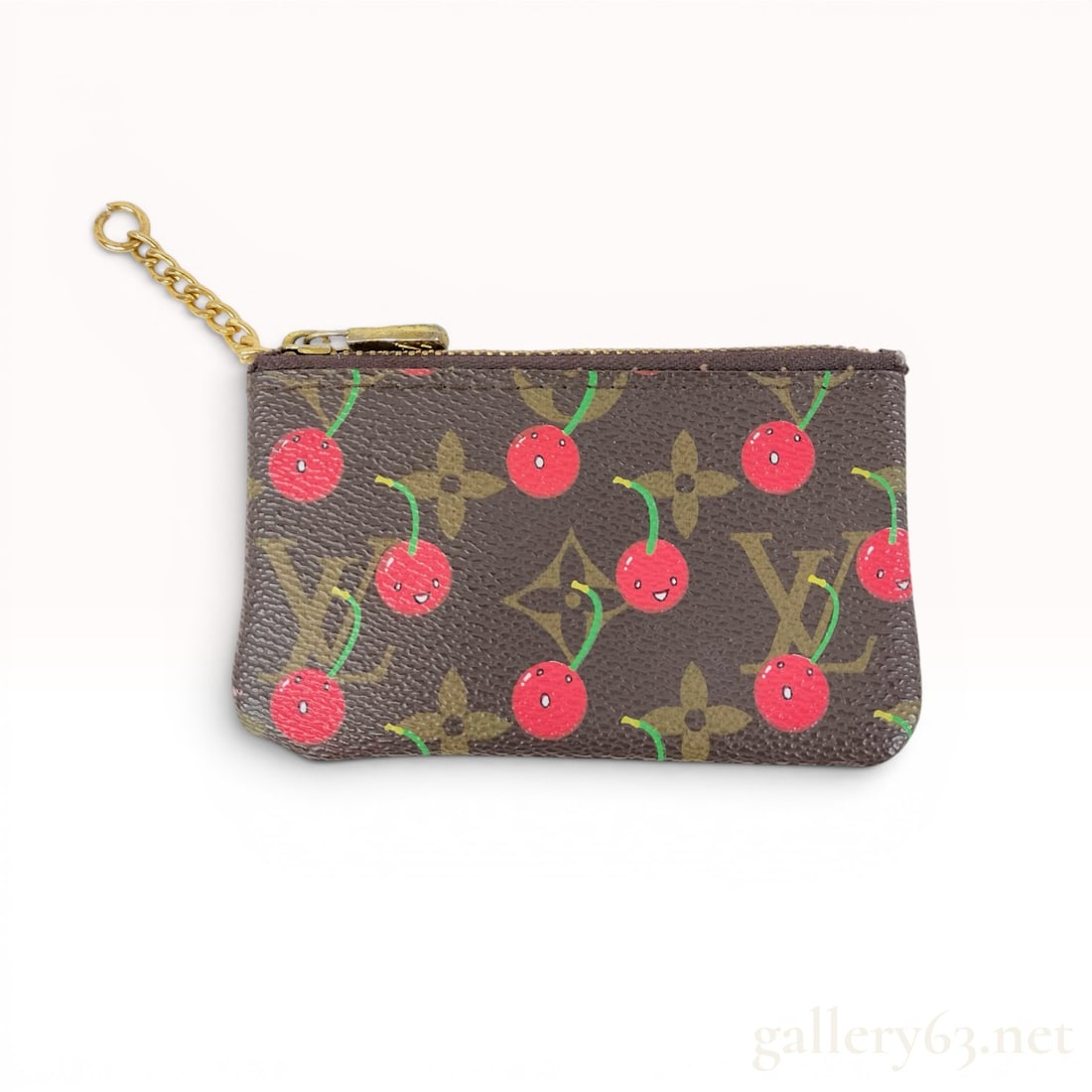Louis Vuitton x Takashi Murakami Monogram Cerises Key Pouch: Louis Vuitton x Takashi Murakami Monogram Cerises Pochette Cles key pouch, circa 2005. This limited-edition accessory is crafted from signature monogram coated canvas featuring a smiling cherry motif 