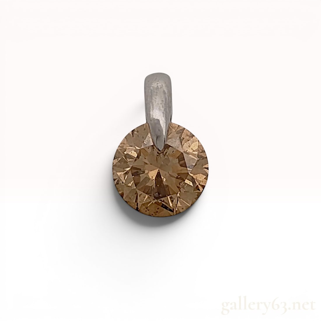 Kashikey Platinum and 2.14 Carat Fancy Brown Diamond Solitaire Pendant: Kashikey solitaire pendant featuring a round brilliant cut brown diamond in a platinum setting. The diamond is held in a partial tension-style mount with an integrated polished bail. The reverse is st