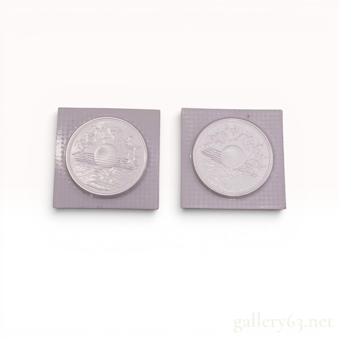 A Pair of Japanese 10,000 Yen .999 Fine Silver Commemorative Coins, 1986: A pair of Japanese 10,000 Yen silver commemorative coins issued by the Japan Mint in 1986 (Showa 61) to honor the 60th anniversary of Emperor Hirohito's reign. Struck in .999 fine silver, the coins fe