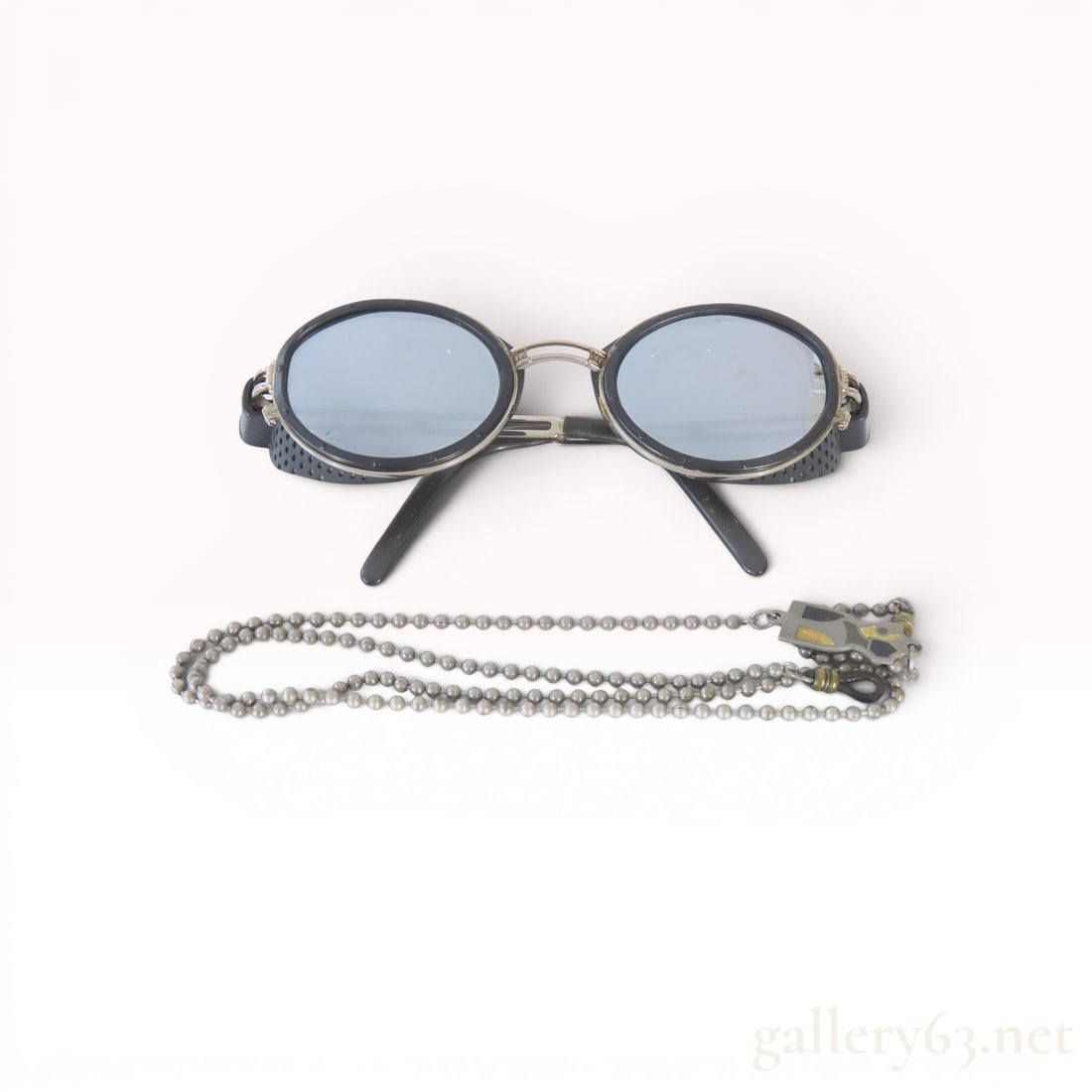 Jean Paul Gaultier Vintage Steampunk Goggle Sunglasses Model 56-6201 with Enameled Chain: Jean Paul Gaultier vintage sunglasses, model 56-6201, featuring a steampunk-inspired industrial goggle design. The eyewear consists of oval lenses within silver-toned metal frames with perforated blac