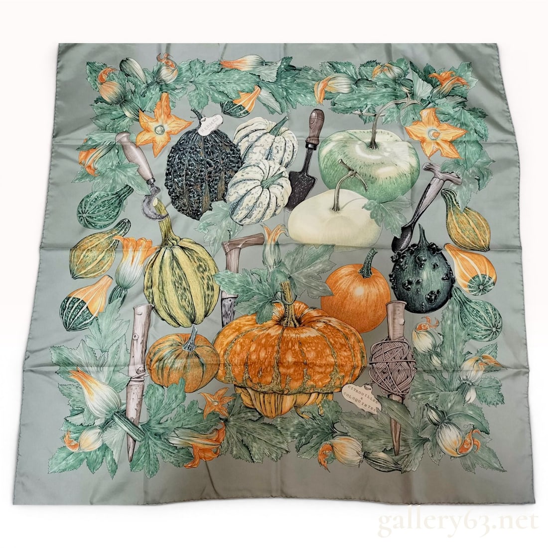 Hermes Citrouilles et Coloquintes Silk Scarf by Valerie Dawlat-Dumoulin: This 90cm silk scarf features the Citrouilles et Coloquintes (Pumpkins and Gourds) design by artist Valérie Dawlat-Dumoulin for the French luxury brand Hermès. The composition displays a