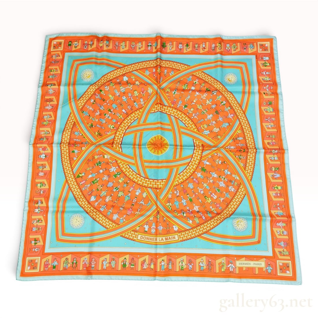 Hermes Donner La Main Silk Scarf w/Box: Hermès silk twill scarf in the Donner La Main pattern designed by Karen Petrossian. The composition features diverse figures in traditional dress holding hands in concentric circles around a ce