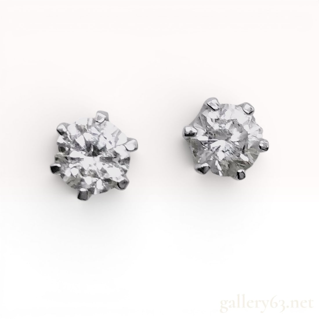 A Pair of Platinum Diamond Six-Prong Crown Stud Earrings (1 of 7)