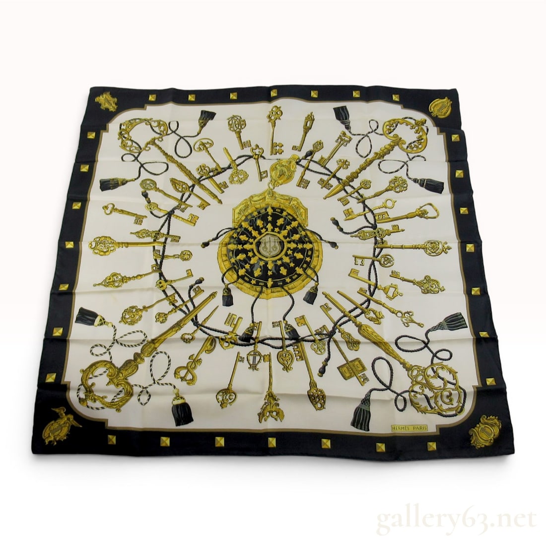Hermes Silk Twill Carre 90 Scarf in Les Clefs Pattern: Hermès silk twill Carré 90 scarf in the Les Clefs pattern, originally designed by Caty Latham in 1965. The cream field displays forty-seven diverse antique keys interconnected by silk co