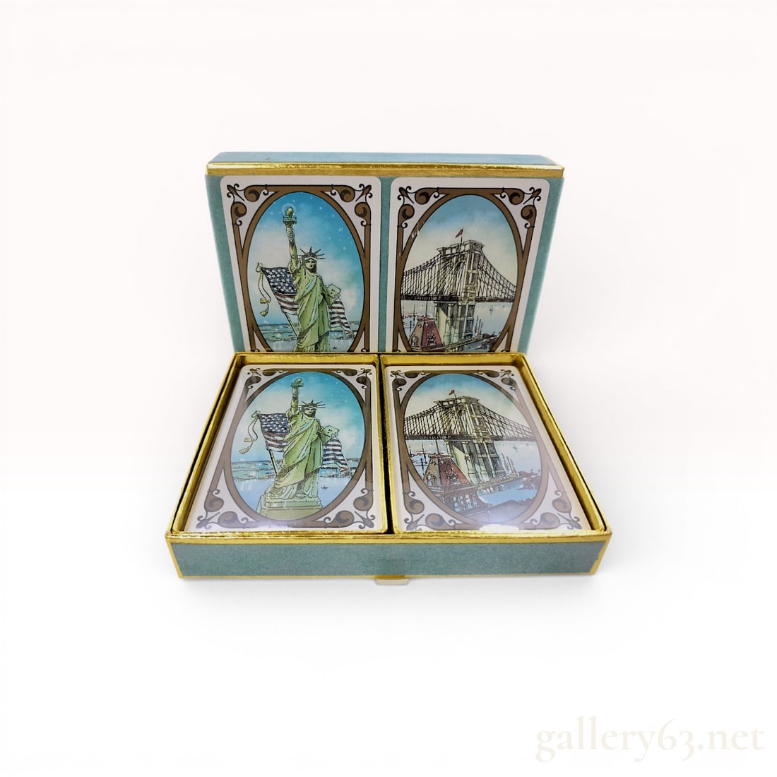 A Pair of Tiffany & Co. New York City Souvenir Playing Card Decks w/Box: This set of two vintage playing card decks is produced by Tiffany & Co. featuring a New York City souvenir theme. The set includes two distinct card back designs: one depicting the Statue of Liber