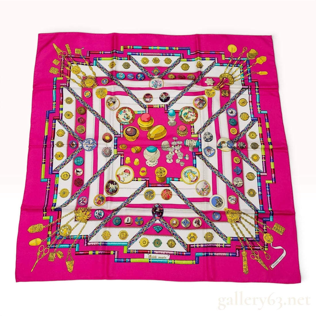 Hermes Petite Main Silk Scarf Carre 90: Hermès silk scarf in the Petite main pattern, late 20th century. Constructed from silk twill, the design features a fuchsia pink field with a white ground decorated with various haberdashery mo