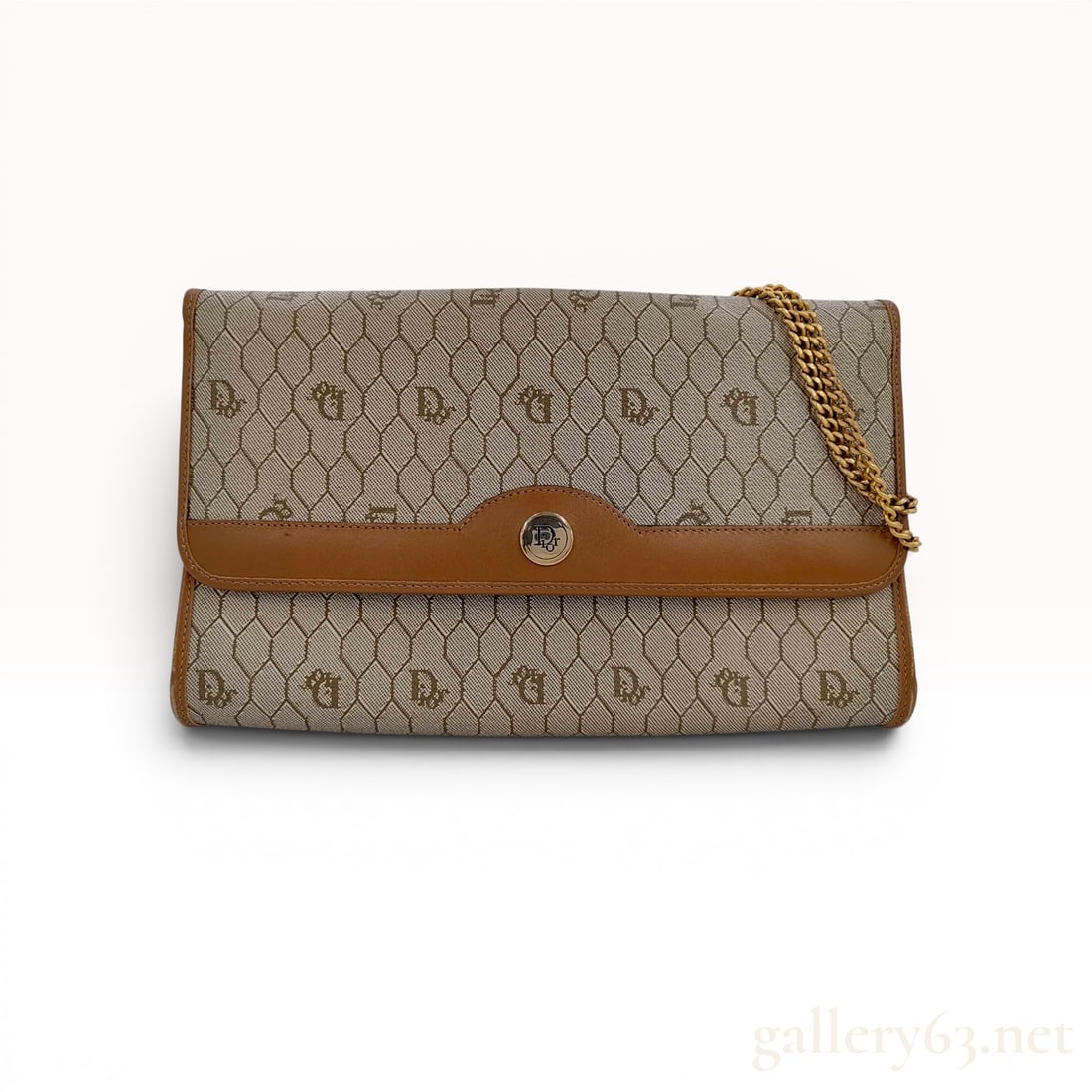 Christian Dior Vintage Honeycomb Coated Canvas Chain Shoulder Bag: Christian Dior vintage honeycomb pattern shoulder bag, circa 1980s. Constructed from beige and tan coated canvas with brown leather trim, this envelope-style bag features a tuckable gold-tone double-l