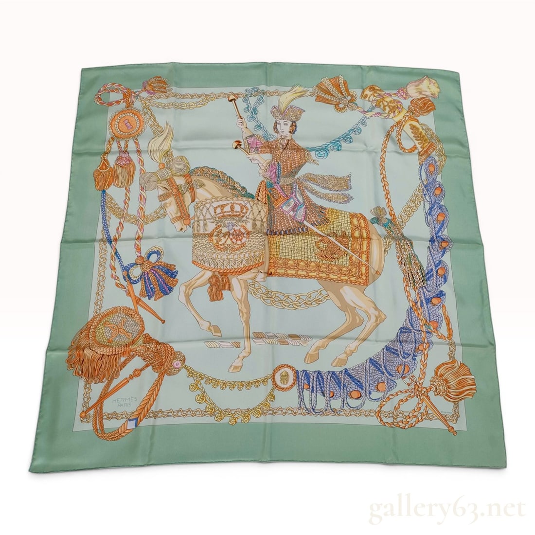 Hermes Le Timbalier Silk Carre Scarf: Hermès silk carre scarf in the Le Timbalier pattern, designed by Francoise Heron and first issued in 1961. The 100 percent silk twill scarf features a central equestrian figure in ceremonial dr