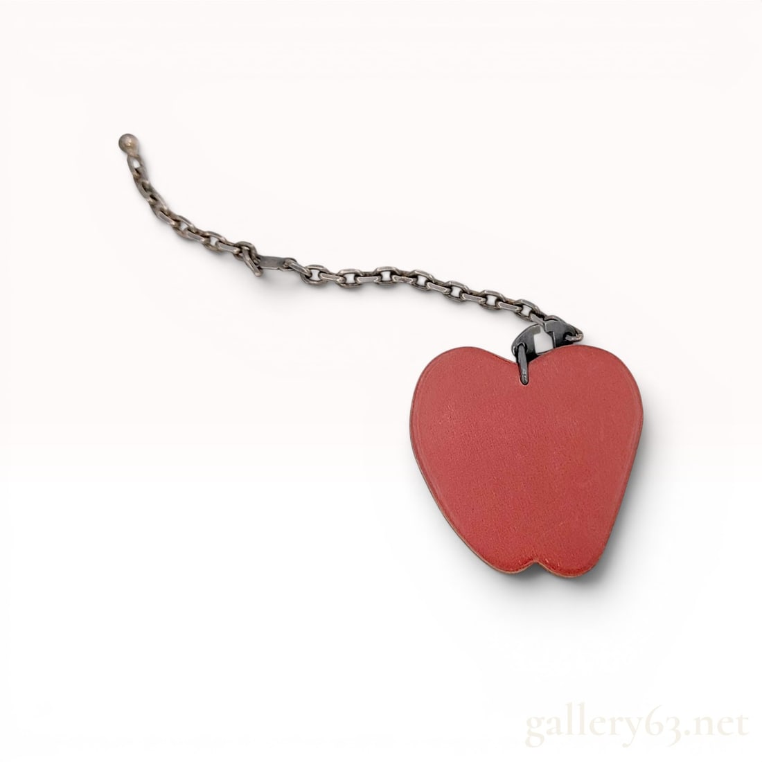 Hermes Red Leather Apple Bag Charm, Sterling Silver: Hermès leather bag charm in the form of a red apple, late 20th to early 21st century. Constructed from red and green textured leather with patinated sterling silver hardware, featuring a green 
