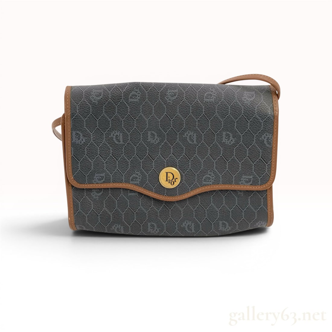 Christian Dior Vintage Honeycomb Monogram Shoulder Bag: Christian Dior vintage shoulder bag in the signature honeycomb monogram pattern on grey and black coated canvas, circa 1980s. Features tan leather piping, a fixed-length leather strap, and a front fla