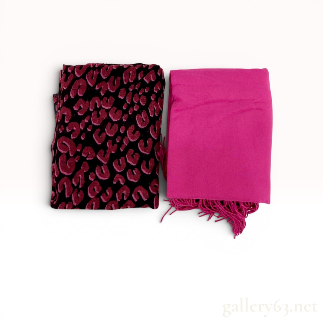 Two Fashion Scarves including a Louis Vuitton Stephen Sprouse Leopard Print Stole and a Fuchsia: Two scarves including a Louis Vuitton leopard print stole in the Stephen Sprouse graffiti style and a solid fuchsia cashmere wrap. The stole features a magenta and black animal pattern with blue graph
