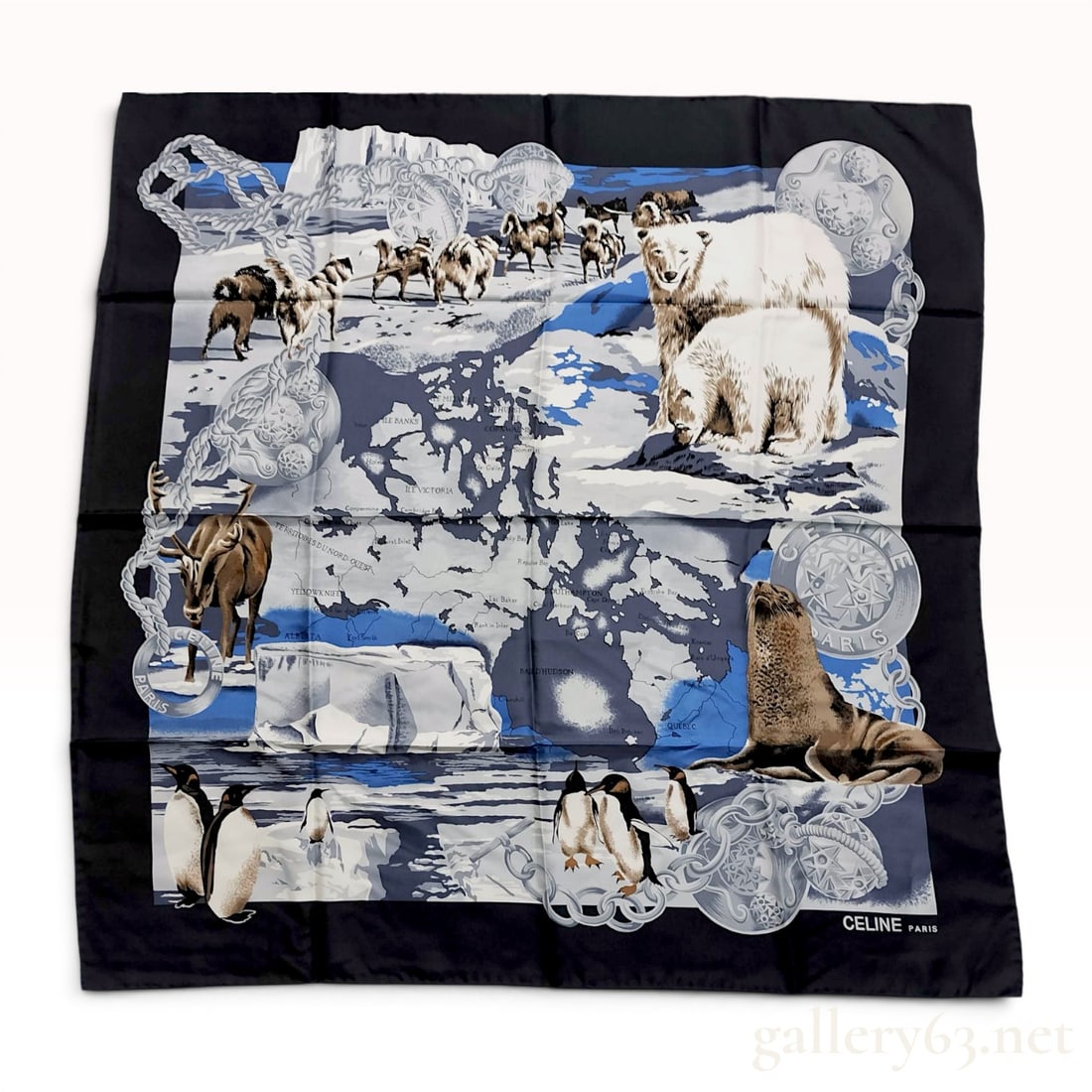Celine Paris Arctic Wildlife and Northern Canada Map Silk Scarf: Celine Paris square silk scarf featuring an Arctic-themed map of Northern Canada and various wildlife, late 20th century. The central composition depicts polar bears, sled dogs, caribou, and penguins 