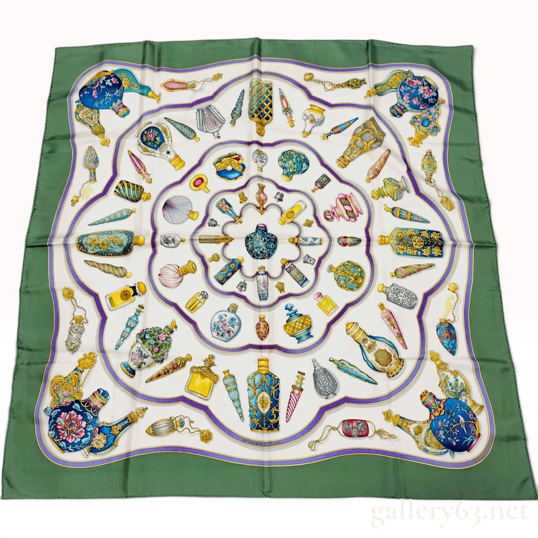 Hermes Silk Pourvu Qu'on Ait L'ivresse Scarf by Catherine Baschet: Hermès silk Carre 90 scarf in the Pourvu qu'on ait l'ivresse pattern designed by artist Catherine Baschet. The composition features a variety of colorful and ornate perfume bottles arranged in 