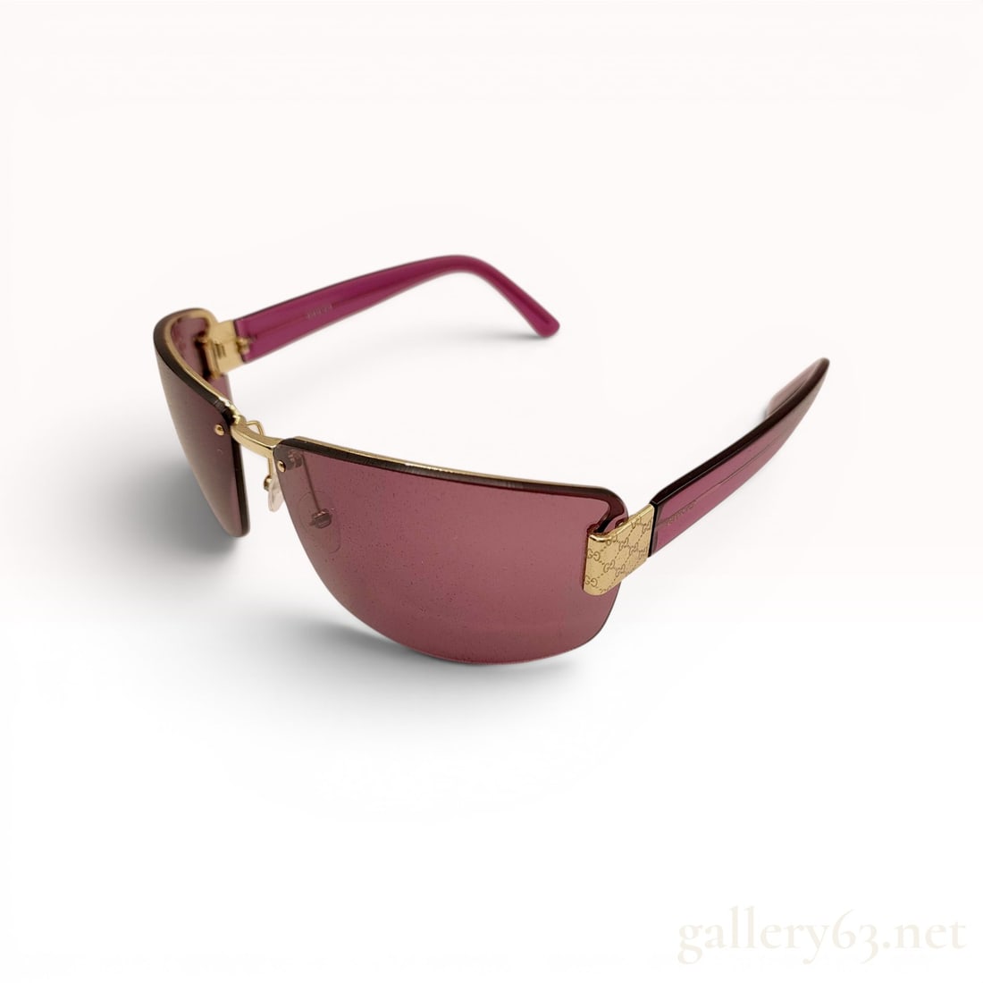 Gucci GG 1800/S Shield Sunglasses with Case: Gucci GG 1800/S shield-style sunglasses, contemporary. Features translucent burgundy lenses with a rimless-bottom design, gold-toned metal top frame, and translucent magenta plastic temples with embos
