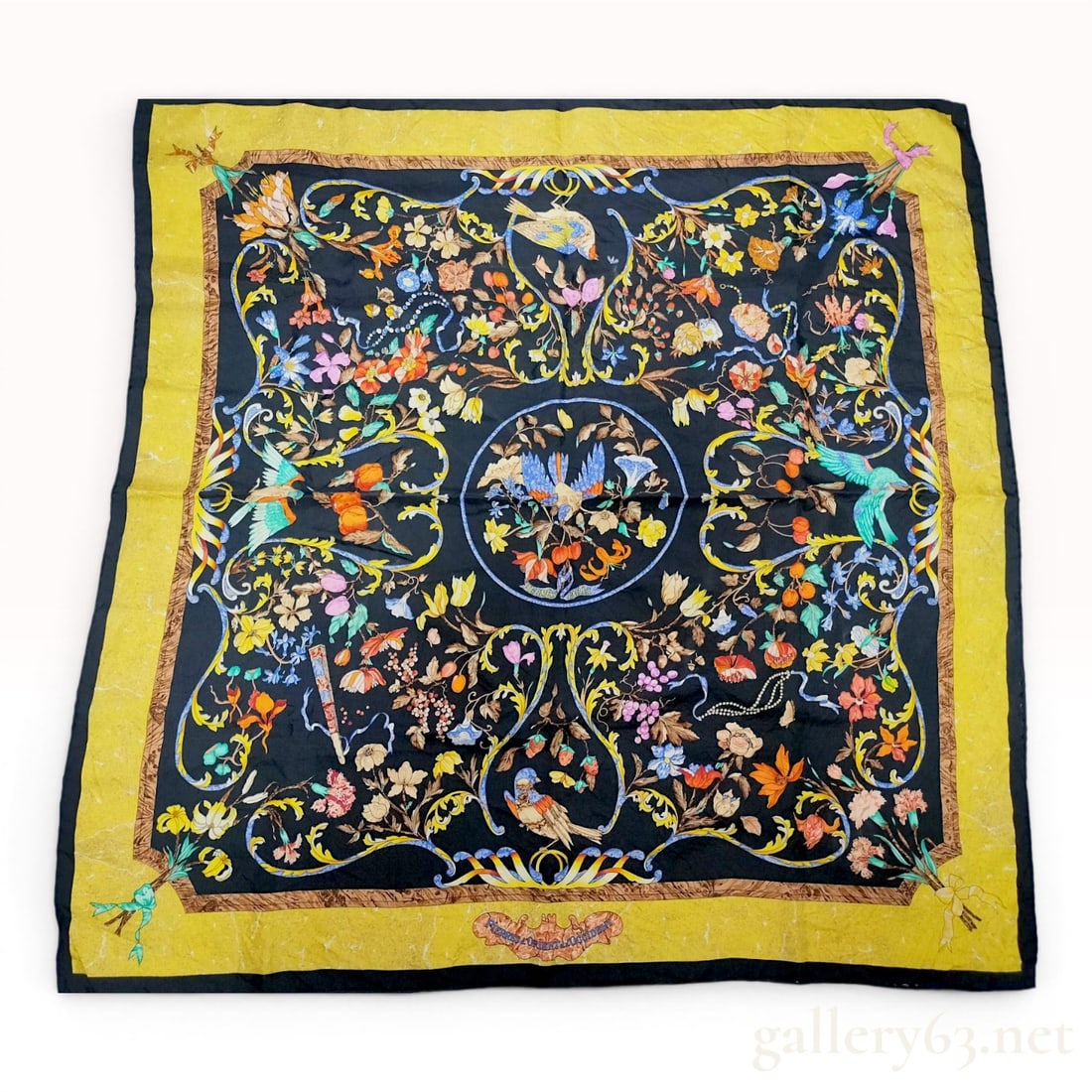Hermes Pierres d'Orient et d'Occident Silk Carre 90 Scarf: A vintage Hermes silk 90cm carre scarf featuring the Pierres d'Orient et d'Occident pattern, first issued in 1988 and designed by Isabelle de Cortivron. The composition features a central circular med