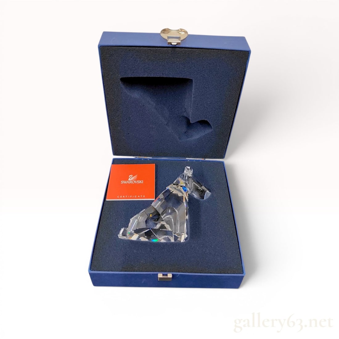 Swarovski Crystal Symbols The Dog Schnauzer Figurine w/Box: Swarovski lead crystal figurine titled The Dog from the Symbols collection, model number 289202. The piece is crafted in multi-faceted clear crystal and depicts a sitting dog with a silver-tone metal 